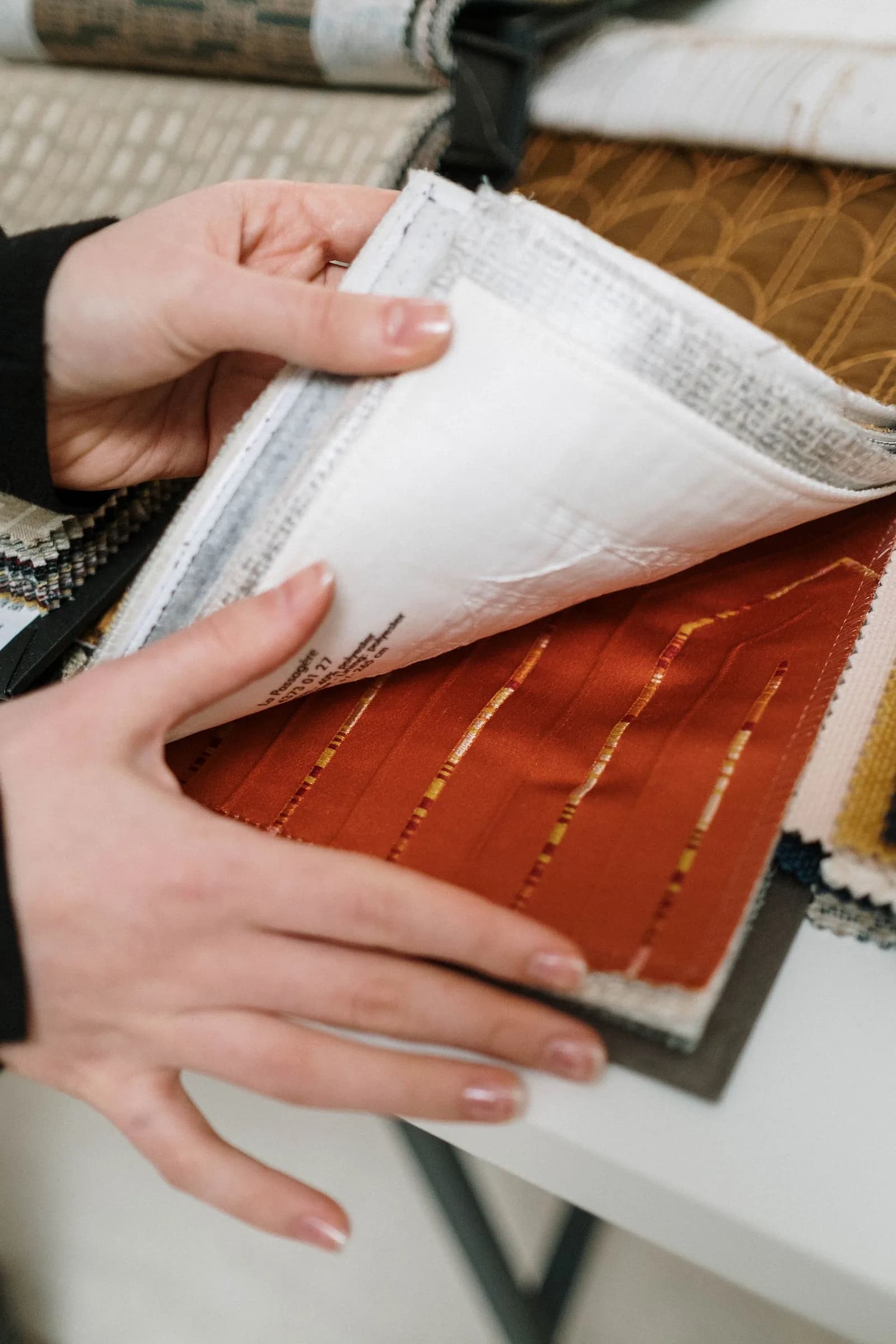 Fabric swatch book being turned